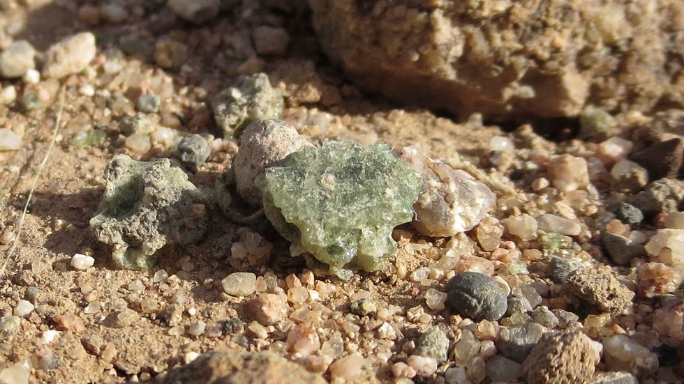 There's still Trinitite scattered all over Ground Zero, and it's still somewhat radioactive.